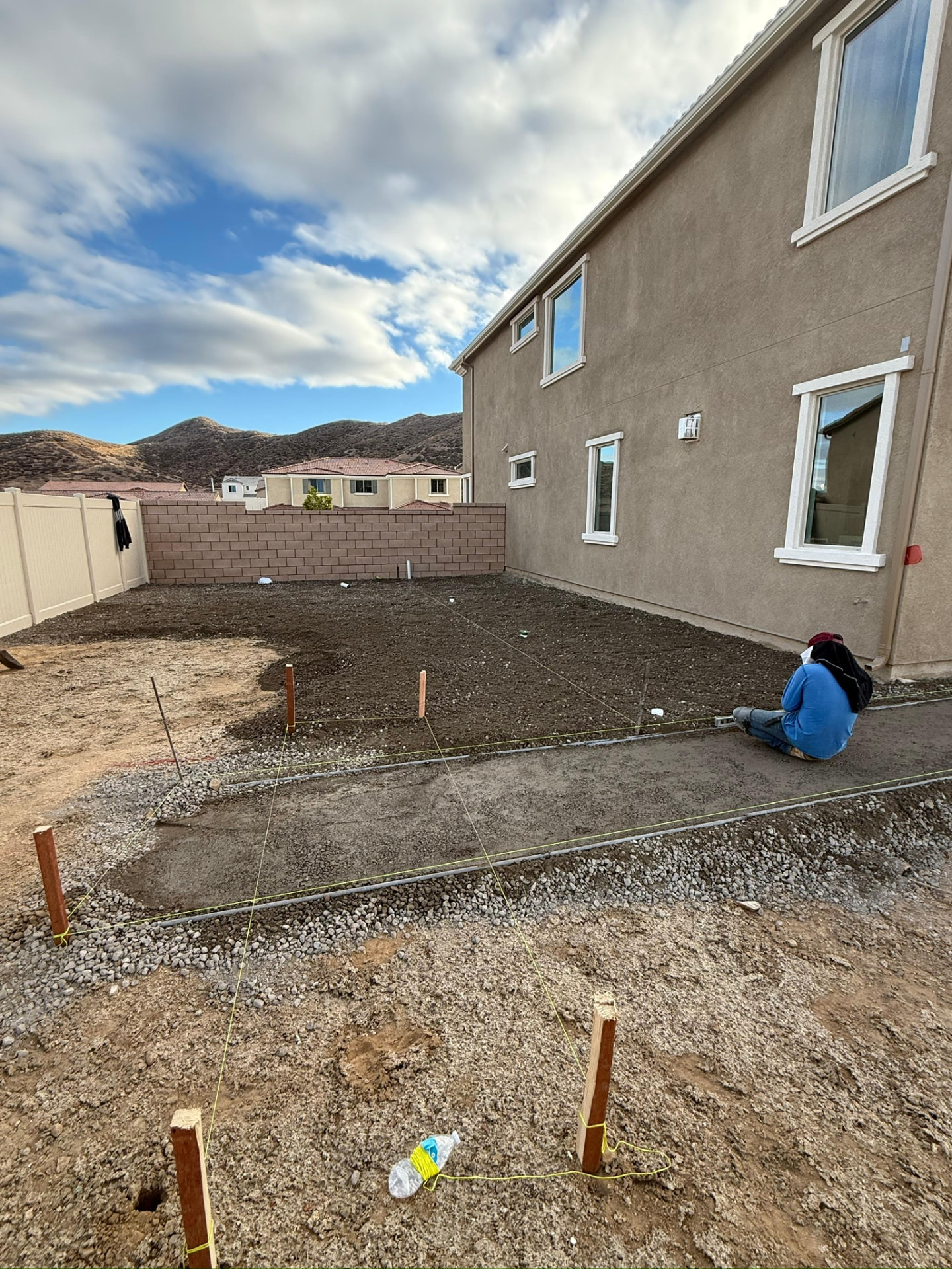 Empty dirt backyard with formed footings