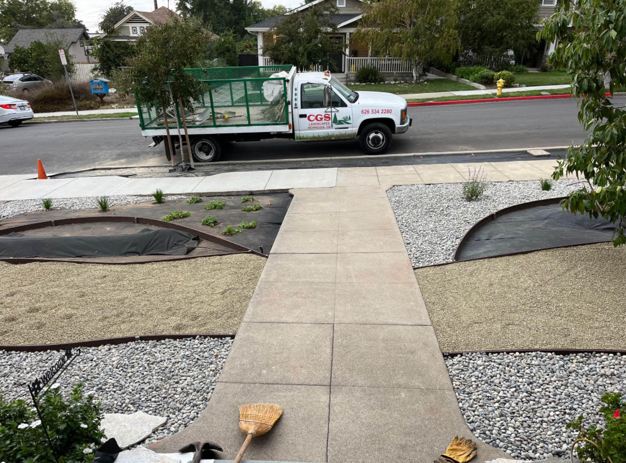 Front yard mid-build with weed barrier, gravel and new walkway