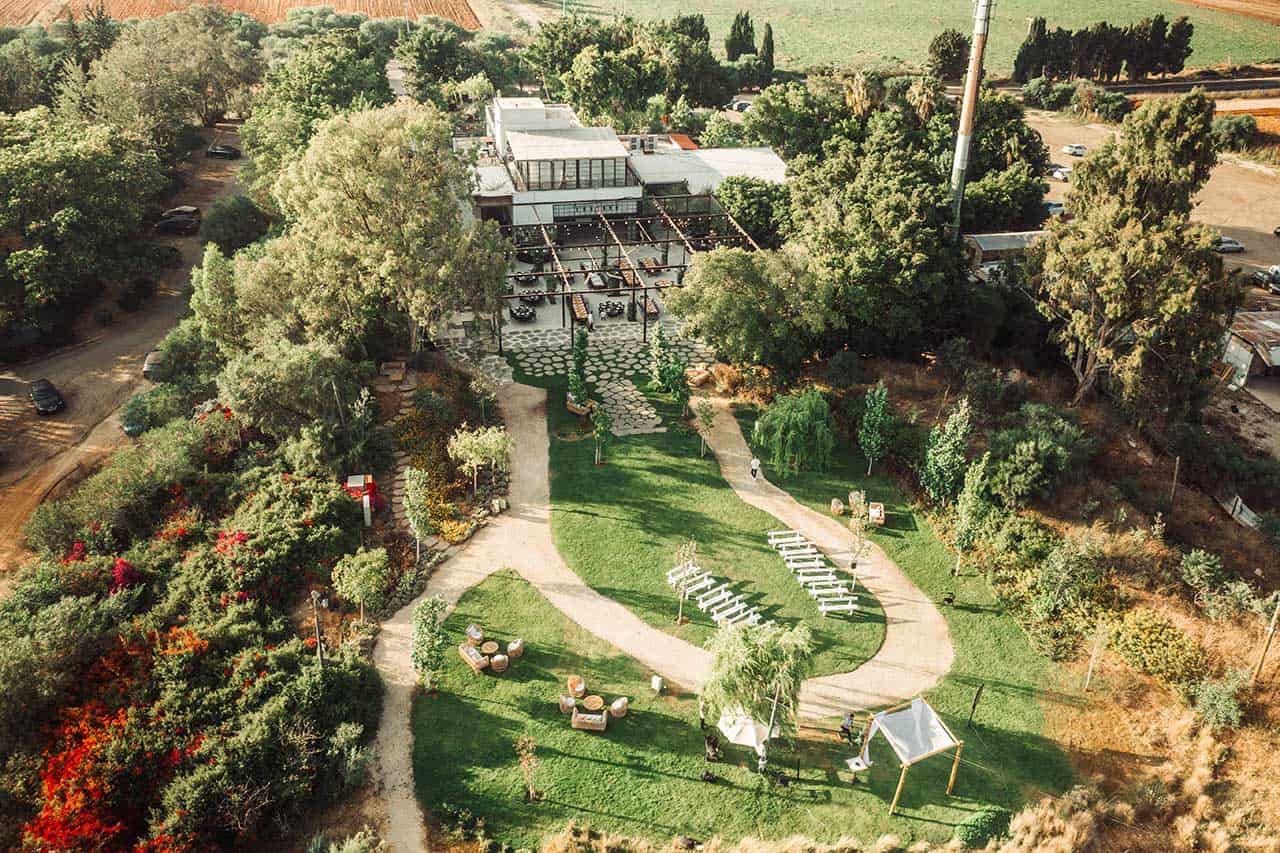Drone view of the finished lawn and stone terrace set up for guests