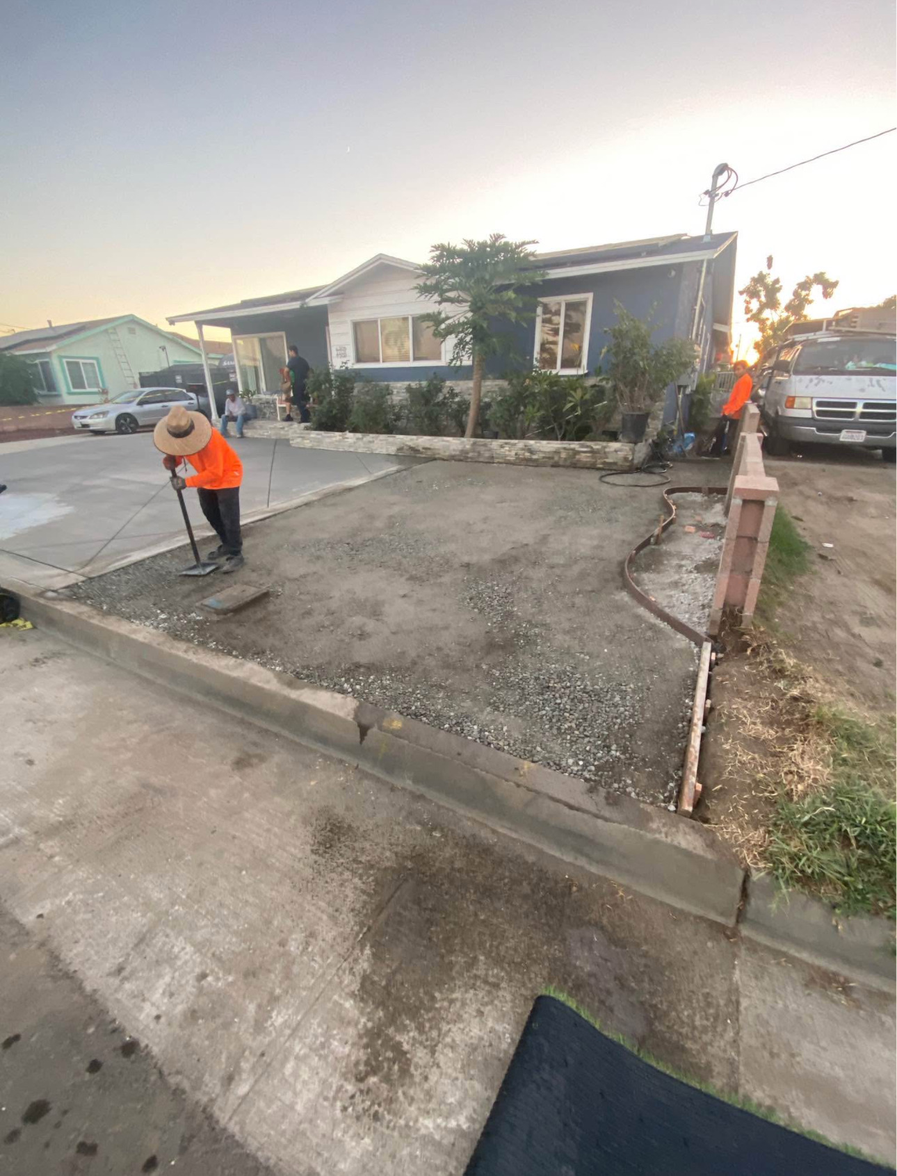 Front yard stripped to base rock with block planter wall going in