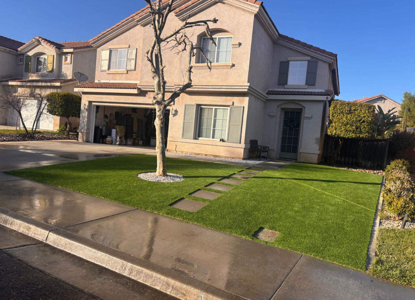 Finished front yard turf lawn with paver stepping stones
