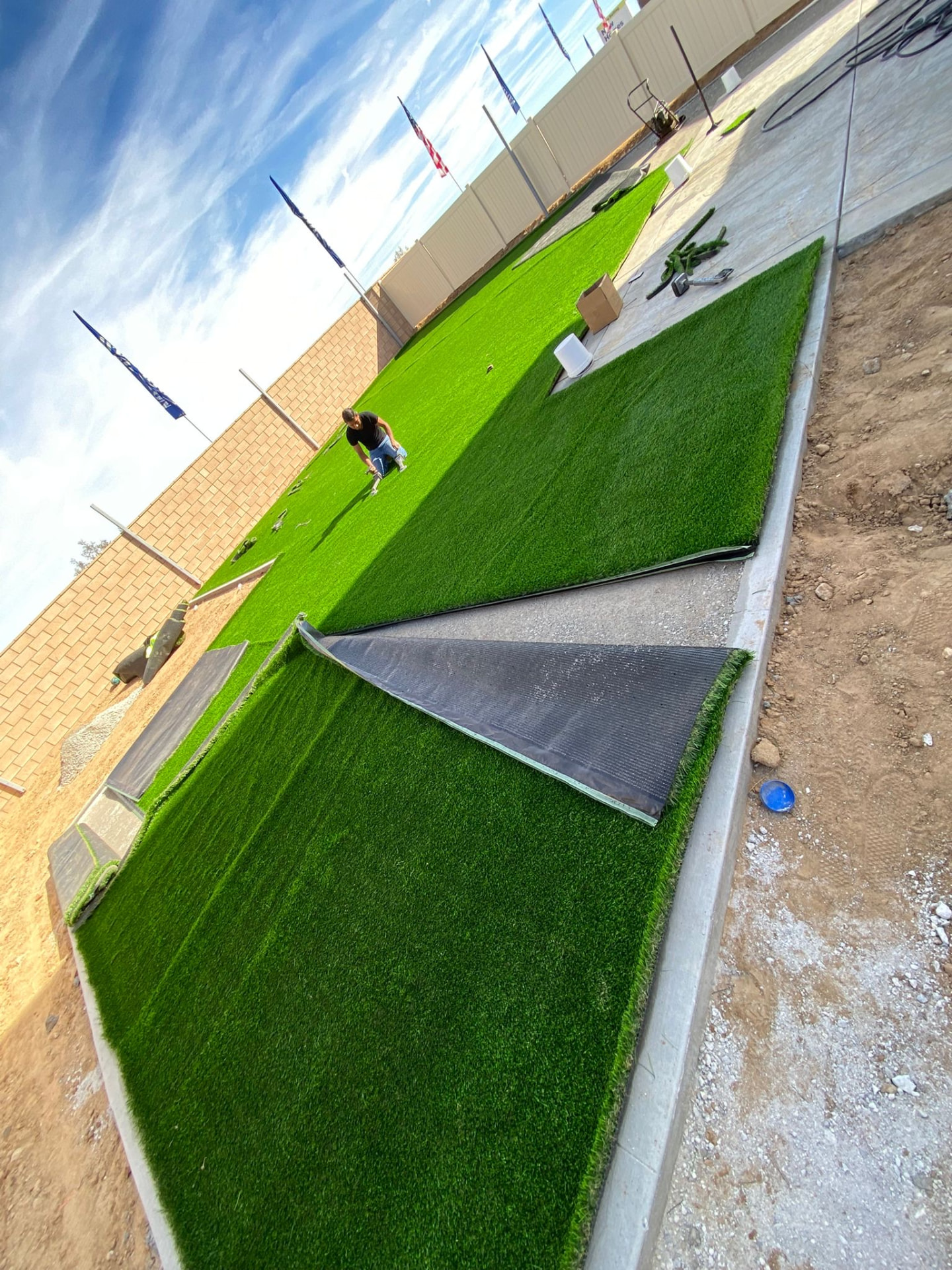 Fresh turf rolled over the finished base