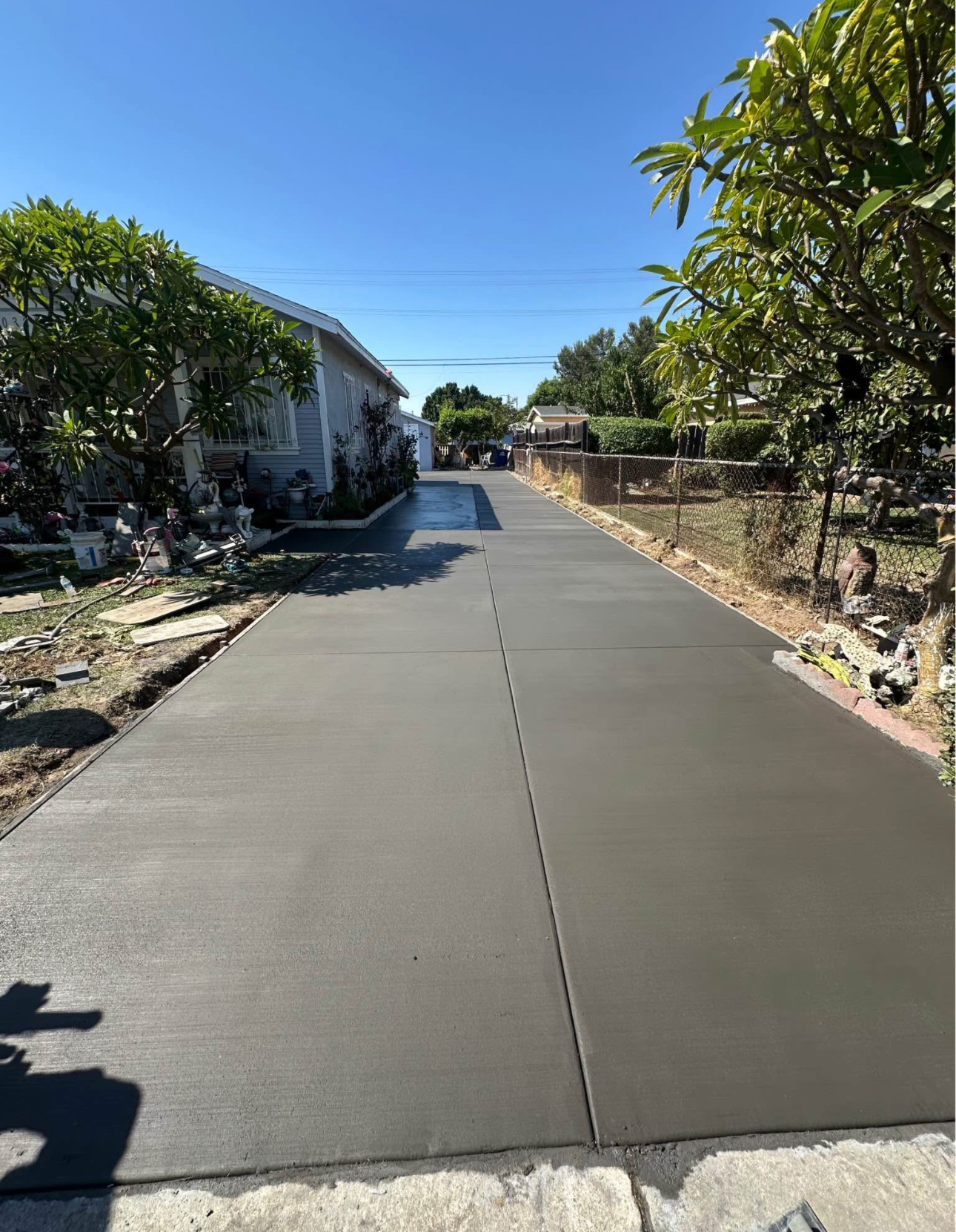 Wide new concrete driveway with control joints