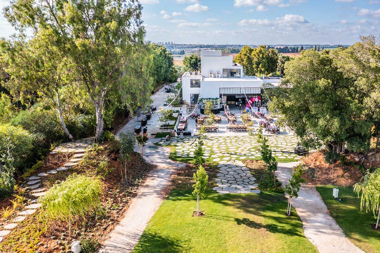 Drone view of the finished flagstone courtyard and lawn with string lights