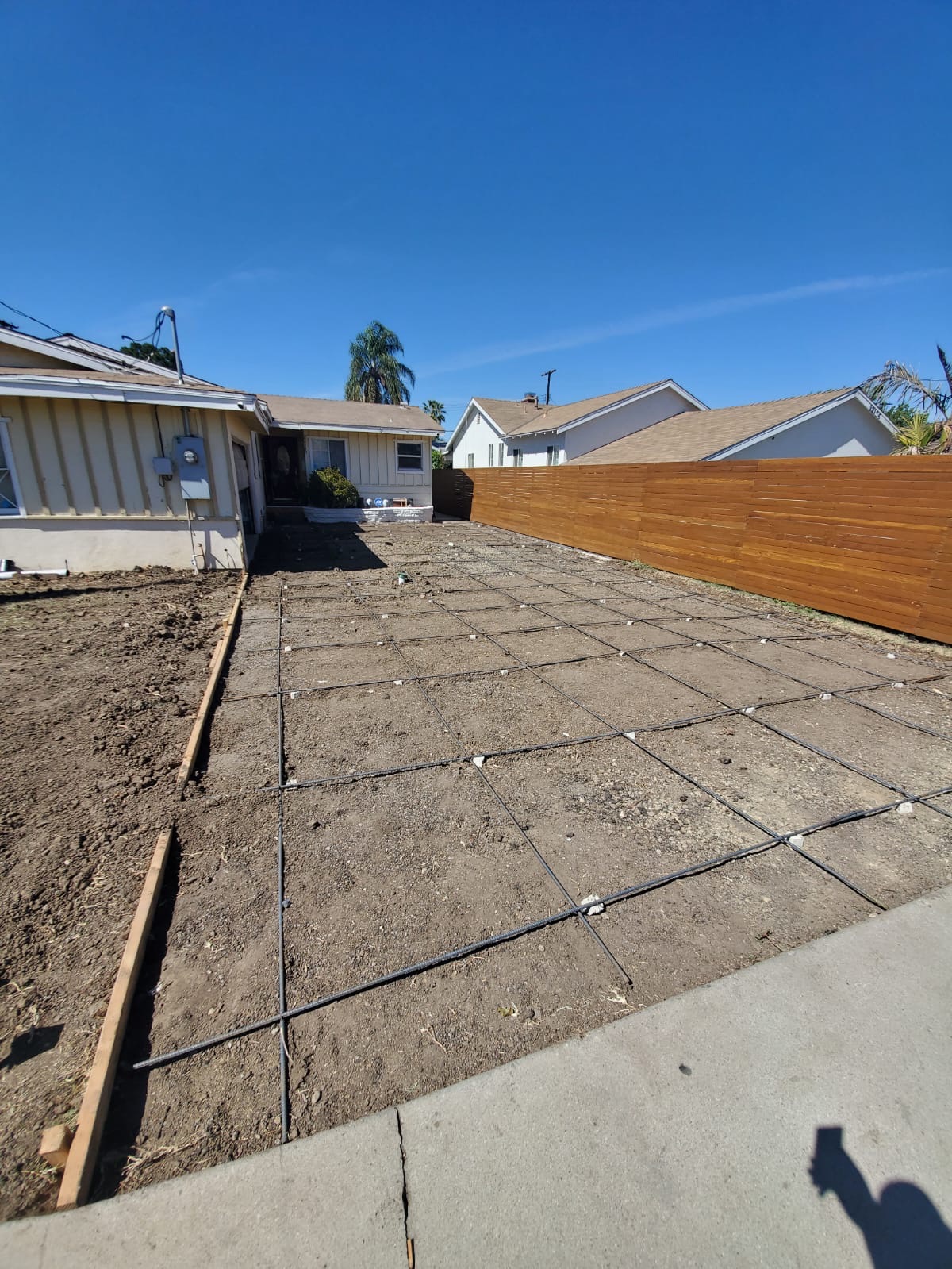 Graded side yard with rebar grid ready for pour